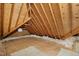 Spacious attic featuring unfinished flooring and exposed beams with insulation at 4701 Regalwood Dr, Raleigh, NC 27613