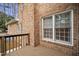 Back of house, with a wooden deck and a brick exterior at 4701 Regalwood Dr, Raleigh, NC 27613