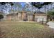 Home featuring a fenced backyard with a deck and attached two car garage at 4701 Regalwood Dr, Raleigh, NC 27613