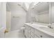 Bright bathroom boasting double sinks, a large mirror, and decorative gold hardware at 4701 Regalwood Dr, Raleigh, NC 27613