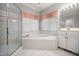 Bright bathroom with a shower, bathtub, and large mirrors over the vanity at 4701 Regalwood Dr, Raleigh, NC 27613