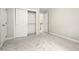 Neutral bedroom featuring plush carpeting, a closet, and an accessible doorway at 4701 Regalwood Dr, Raleigh, NC 27613