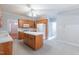 Traditional kitchen features an island, light cabinets, and modern appliances at 4701 Regalwood Dr, Raleigh, NC 27613