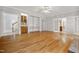 Open-concept living room boasts hardwood floors, built-ins, and access to other living spaces at 4701 Regalwood Dr, Raleigh, NC 27613