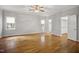 Bright bedroom with hardwood floors, ceiling fan, and walk-in closet at 4701 Regalwood Dr, Raleigh, NC 27613