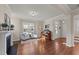 Living room with hardwood floors, fireplace, and built-in shelves at 6604 Truxton Ln, Raleigh, NC 27616