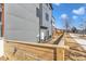 Backyard view with a wood fence and gray siding and green grass at 1000 Addison Pl # 101, Raleigh, NC 27610