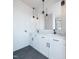 Bathroom featuring double sinks, modern fixtures, and pendant lighting at 1000 Addison Pl # 101, Raleigh, NC 27610