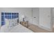 Cozy bedroom with a blue headboard, comfortable bed, and a bedside table with a lamp at 1000 Addison Pl # 101, Raleigh, NC 27610
