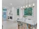 Bright dining room with a modern table, stylish chairs, fireplace, and large windows with natural light at 1000 Addison Pl # 101, Raleigh, NC 27610