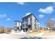 Newly built townhomes feature modern design, gray siding, and garage parking at 1000 Addison Pl # 101, Raleigh, NC 27610