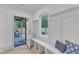 Mudroom with seating, storage, and access to outdoor patio at 1000 Addison Pl # 101, Raleigh, NC 27610