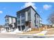 Modern townhomes featuring neutral exteriors, private entrances, and well-maintained landscaping at 1000 Addison Pl # 102, Raleigh, NC 27610