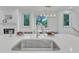 Modern kitchen sink and countertop with window view at 1000 Addison Pl # 102, Raleigh, NC 27610