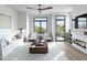 Bright living room featuring stylish furniture, modern fireplace and balcony access at 1000 Addison Pl # 102, Raleigh, NC 27610