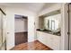 Bathroom featuring double bowl sinks, wooden accents, and an open layout at 1212 Southgate Dr, Raleigh, NC 27610