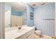 Bathroom with patterned walls and shower-tub combo at 1212 Southgate Dr, Raleigh, NC 27610