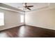 Spacious bedroom with trey ceiling, ceiling fan, and hardwood floors throughout at 1212 Southgate Dr, Raleigh, NC 27610