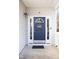 Charming entrance with a blue front door, sidelights, and 'Welcome' decor at 1212 Southgate Dr, Raleigh, NC 27610