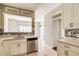 Charming kitchen with white cabinets, stainless steel appliances, and stylish backsplash at 1212 Southgate Dr, Raleigh, NC 27610