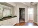 A well-lit Primary bathroom with double sinks, walk-in closet, and separate shower stall at 1212 Southgate Dr, Raleigh, NC 27610