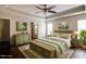 Cozy main bedroom features a tray ceiling, fan, and decorative rug at 1212 Southgate Dr, Raleigh, NC 27610