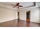Inviting primary bedroom with a ceiling fan, and an en suite bathroom, and hardwood floors at 1212 Southgate Dr, Raleigh, NC 27610