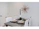Contemporary dining area with sleek chairs, modern place settings, and a decorative light fixture at 1309 Hudson Ave # A7, Durham, NC 27705