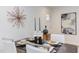 Elegant dining area with a decorative art piece and stylish place settings at 1309 Hudson Ave # A7, Durham, NC 27705