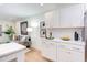 Modern kitchen with white cabinets and quartz countertops at 1309 Hudson Ave # A7, Durham, NC 27705