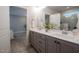 Bathroom with double vanity, quartz countertop, and walk-in shower at 167 Logbridge Rd, Chapel Hill, NC 27516