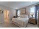 Bright bedroom features a queen bed, wood floors, and natural light from the windows at 167 Logbridge Rd, Chapel Hill, NC 27516