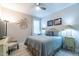 Inviting bedroom with a ceiling fan, bedside lamps, and comfortable blue bedding at 167 Logbridge Rd, Chapel Hill, NC 27516
