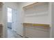 Walk-in closet with built in shelving and hanging racks for maximum storage capacity at 167 Logbridge Rd, Chapel Hill, NC 27516