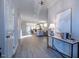 Inviting entryway with light wood floors leading into a spacious living area with modern decor and abundant natural light at 167 Logbridge Rd, Chapel Hill, NC 27516