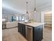 Open concept living space featuring a kitchen island with pendant lighting and stainless steel appliances at 167 Logbridge Rd, Chapel Hill, NC 27516