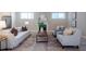 Cozy living room with comfortable seating, a fireplace, and wood floors, perfect for relaxing and entertaining at 167 Logbridge Rd, Chapel Hill, NC 27516