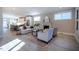 Spacious living room offering a view into the kitchen, neutral decor, and ample seating space at 167 Logbridge Rd, Chapel Hill, NC 27516