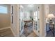 Bright home office through double doors featuring a patterned rug, modern desk, and natural light at 167 Logbridge Rd, Chapel Hill, NC 27516