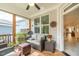 Screened-in porch with wood floors, a ceiling fan, and comfortable furniture at 167 Logbridge Rd, Chapel Hill, NC 27516