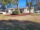 Brick ranch house with landscaped yard and mature trees at 1905 Ephesus Church Rd, Chapel Hill, NC 27517