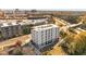Elevated view of a contemporary building with a pristine white exterior and solar panels, plus easy access to a nearby highway at 600 S Duke St # 26, Durham, NC 27701