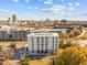 Scenic aerial view of modern apartment complex surrounded by mature trees, showcasing architectural design and street access at 600 S Duke St # 26, Durham, NC 27701