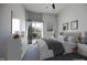 Bright bedroom with a comfortable bed, balcony access, and contemporary furnishings at 600 S Duke St # 26, Durham, NC 27701
