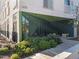 Building entrance with glass doors, green accents, and landscaped walkway provides a welcoming arrival at 600 S Duke St # 26, Durham, NC 27701