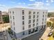 Contemporary building boasts a sleek white exterior with ample windows and well-maintained landscaping at 600 S Duke St # 26, Durham, NC 27701