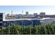 Rooftop view of a blue apartment building with a water tower in the background at 600 S Duke St # 26, Durham, NC 27701