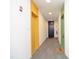Apartment hallway showing the unit doors, an elevator, fire extinguisher, and a 'welcome' mat at 600 S Duke St # 26, Durham, NC 27701