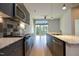 Bright open kitchen with granite countertops, stainless steel appliances, and modern cabinetry at 600 S Duke St # 26, Durham, NC 27701