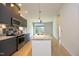 Open kitchen featuring granite countertops, stainless steel appliances, and a breakfast bar at 600 S Duke St # 26, Durham, NC 27701